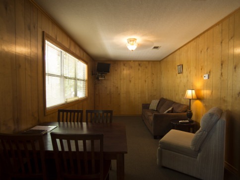 Den area in cabin at Swaha Lodge & Marina.