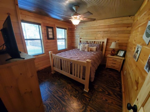 Master bedroom in cabin at Swaha Lodge & Marina.
