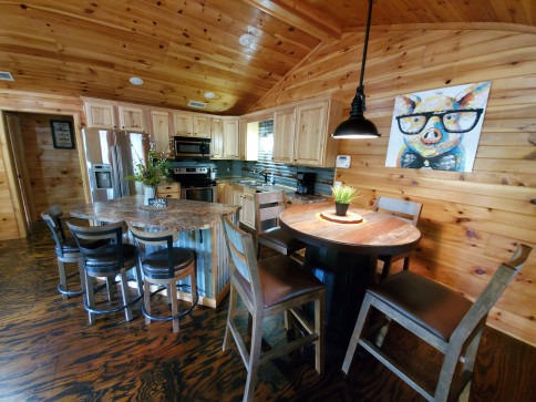 Dining and kitchen area in cabin at Swaha Lodge & Marina.