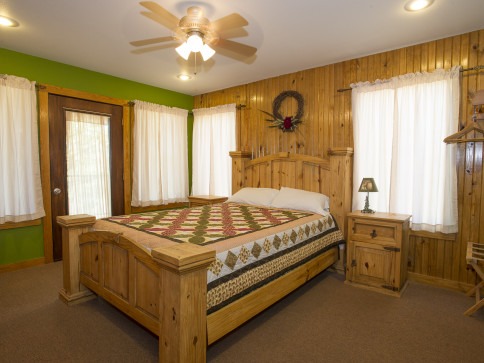 Bedroom at wood cabin at Swaha Lodge & Marina.